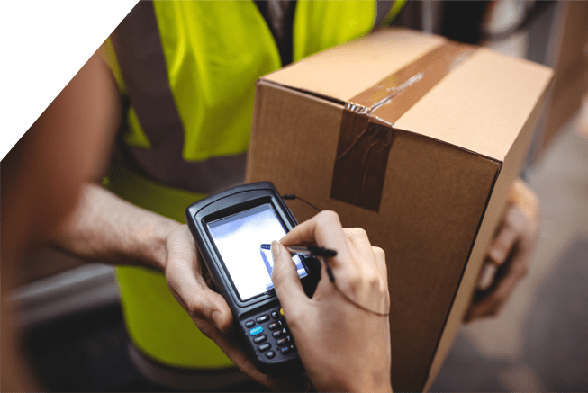 Woman signing for courier delivered parcel